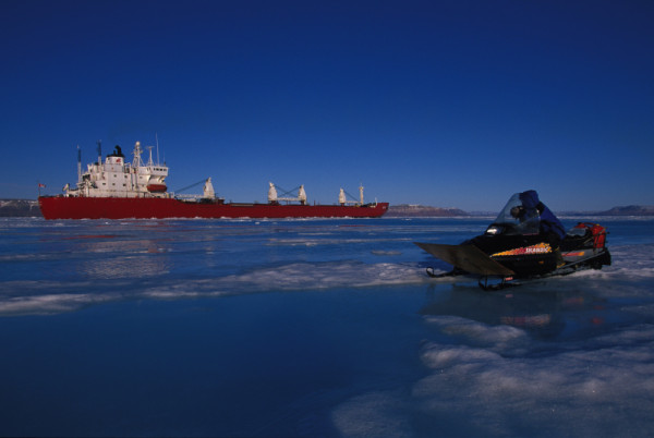 An Inuk man watches an icebreaker © Paul Nicklen/National Geographic Stock / WWF-Canada