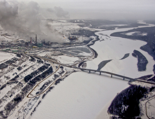 The Athabasca River flows by the oil sands in Alberta, Canada.