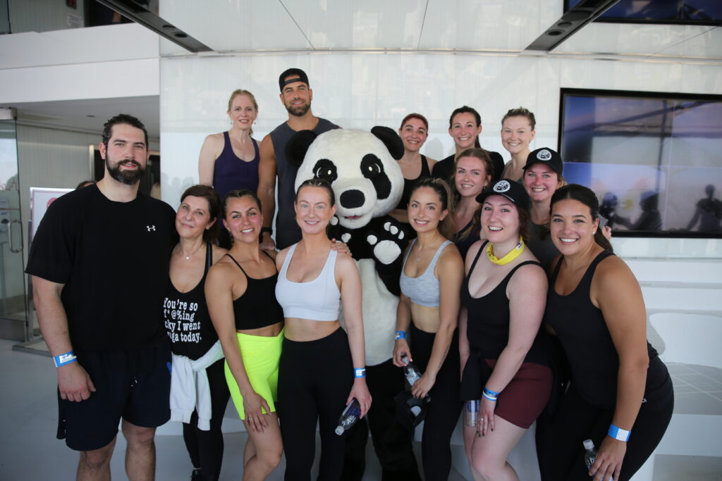 Conservationist and reality TV star Blake Moynes (The Bachelorette), with his team at the top of the CN Tower. © Justin Kielly. 