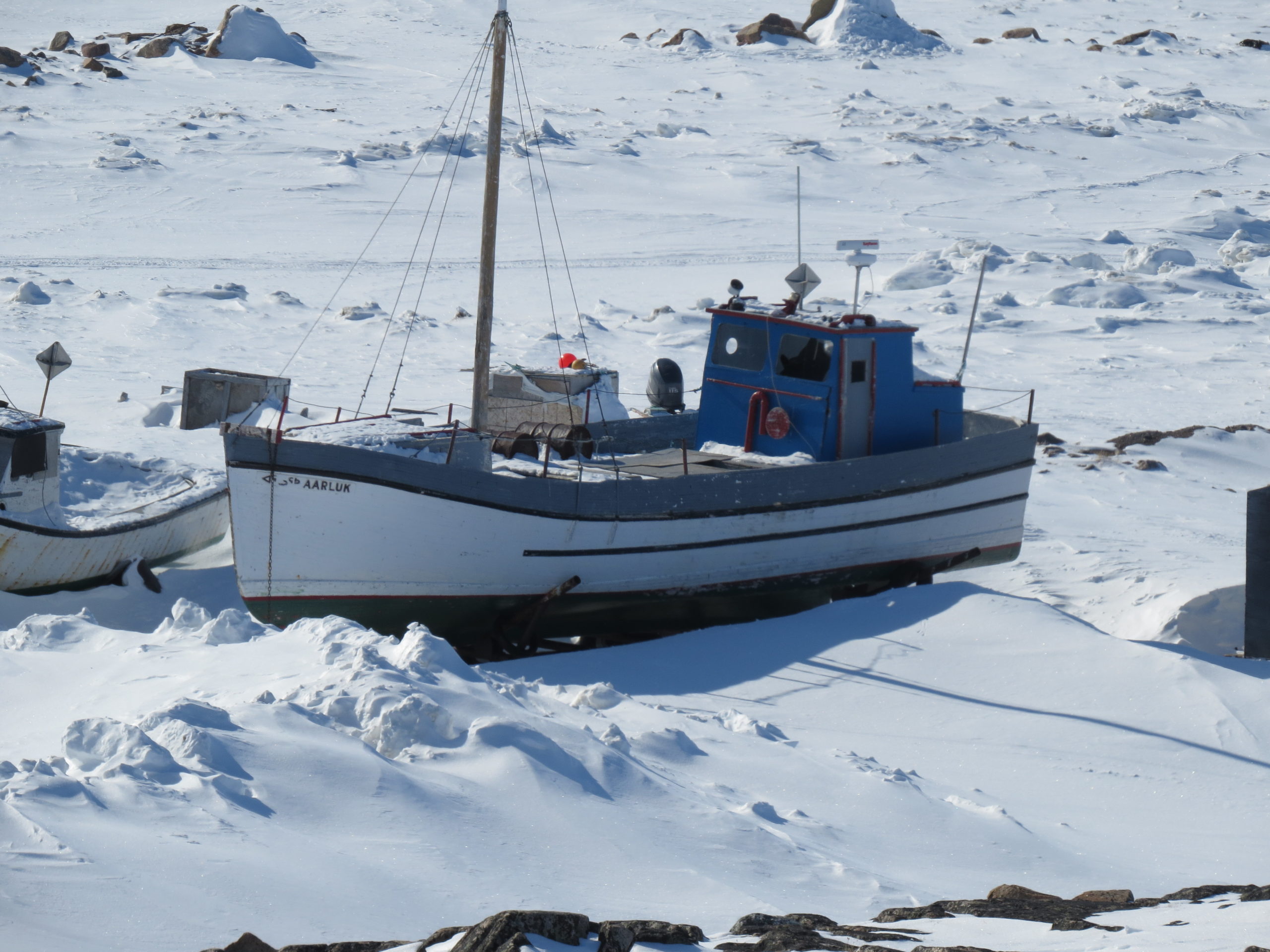 Arctic fishing boat on ice