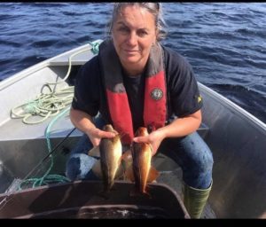 Woman holding golden cod