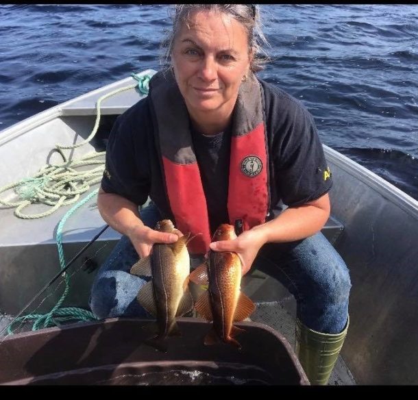 Woman holding golden cod