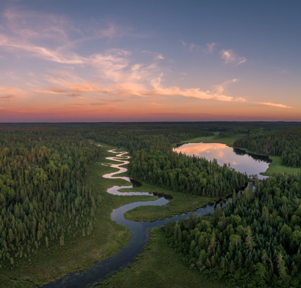 Aerial view of a winding river and trees in Northern Ontario