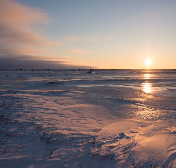 Sunrise over icy landscape in Churchill