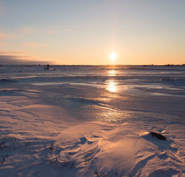 Sunrise over icy landscape in Churchill