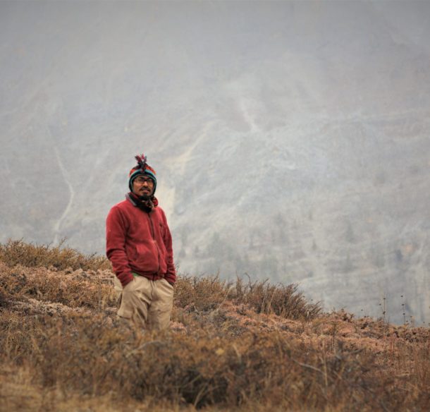 Snow leopard conservationist on a hill