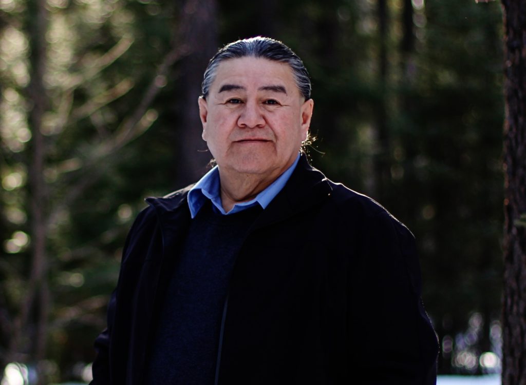 Vern Cheechoo standing in the woods