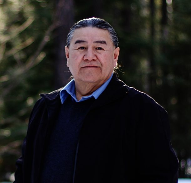 Vern Cheechoo standing in the woods