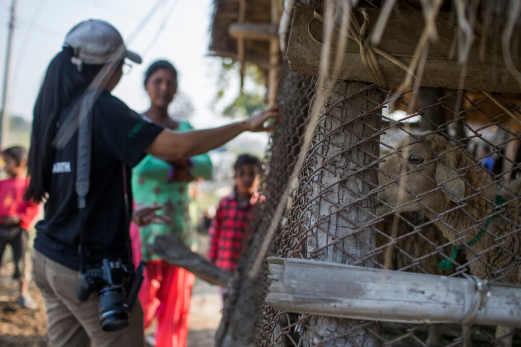 Sabita Malla, tiger expert at WWF Nepal, is discussing with villagers located in the Khata Corridor, on how to better protect livestock from wild animals like tigers and leopards. © Emmanuel Rondeau / WWF-US 