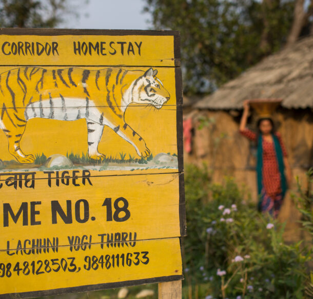 Homestay near tiger habitat, Nepal with a sign warning of tigers.