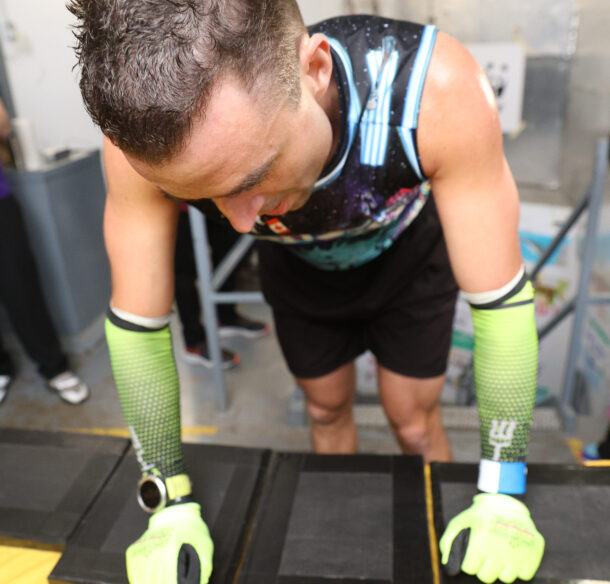 Tyler Kruschenske taps his wrist and at the top of the CN Tower stairwell.